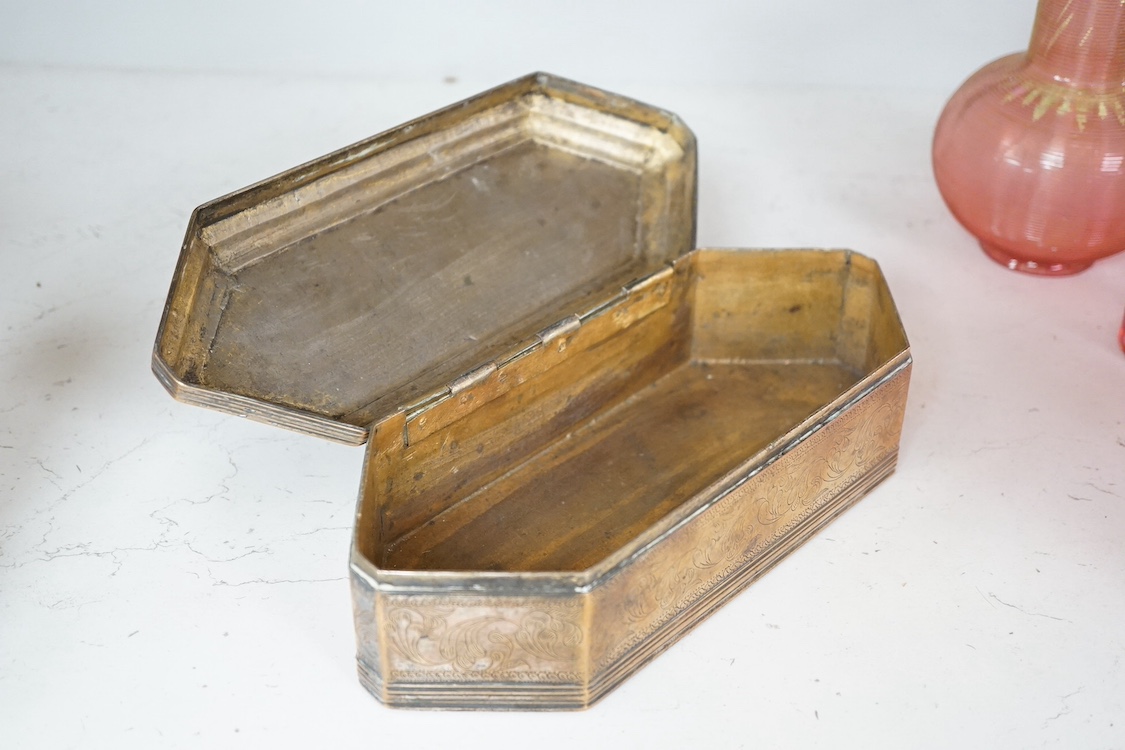 A Persian brass pen box with engraved foliate decoration, 24cm wide. Condition - fair/good